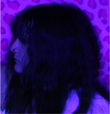 This is a photograph I took of myself staring to the left. It's purple.